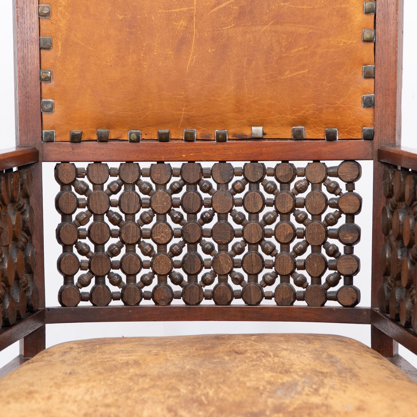 photo furniture Liberty & Co. A Moorish Arts & Crafts Walnut Armchair With Original Leather Seat
