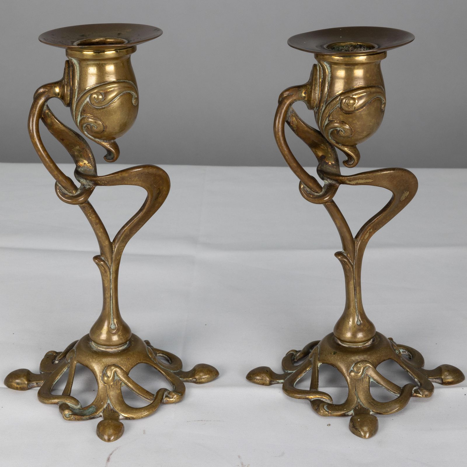 A Pair Of English Art Nouveau Candlesticks With Flowing Organic Decor photo 750.0