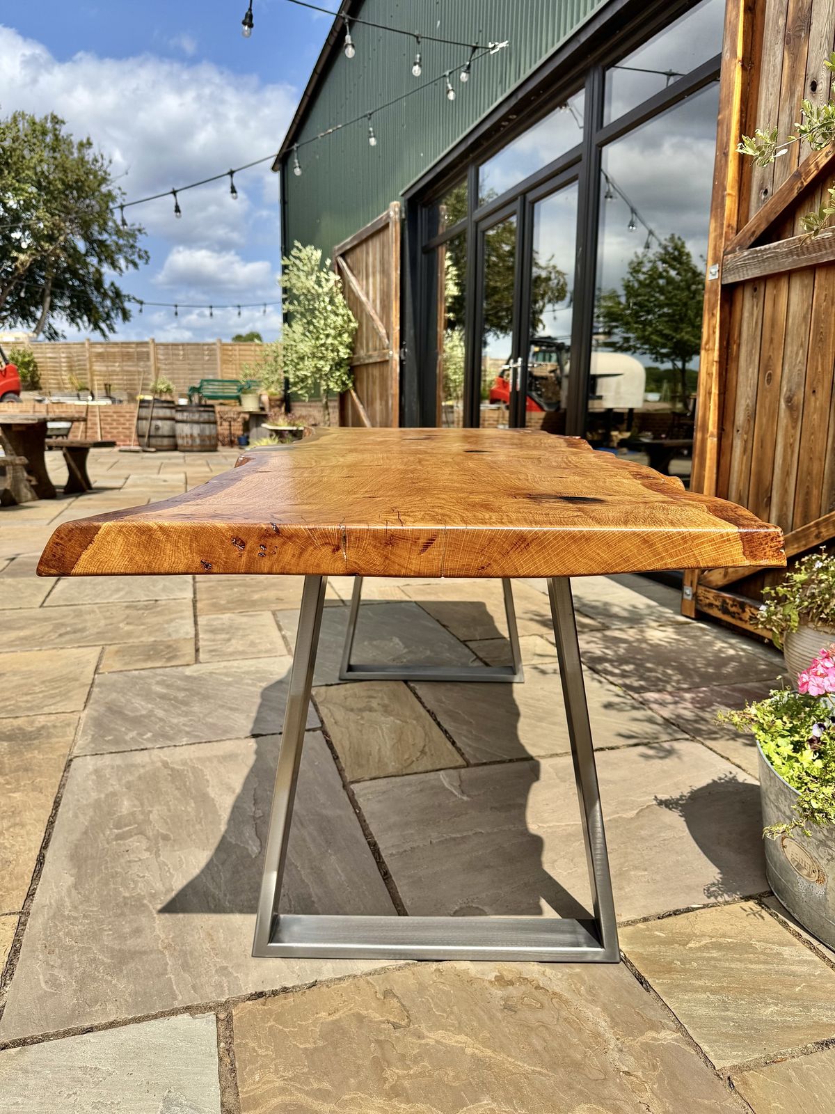 photo furniture Handmade English Oak Live Edge Dining Table With Brushed Steel Legs