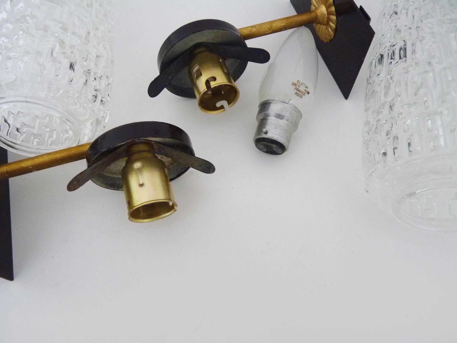 photo furniture Superb Pair Of Brass Wall Sconces With Glass Globes. The Black Wall Part Is Made Of Metal.