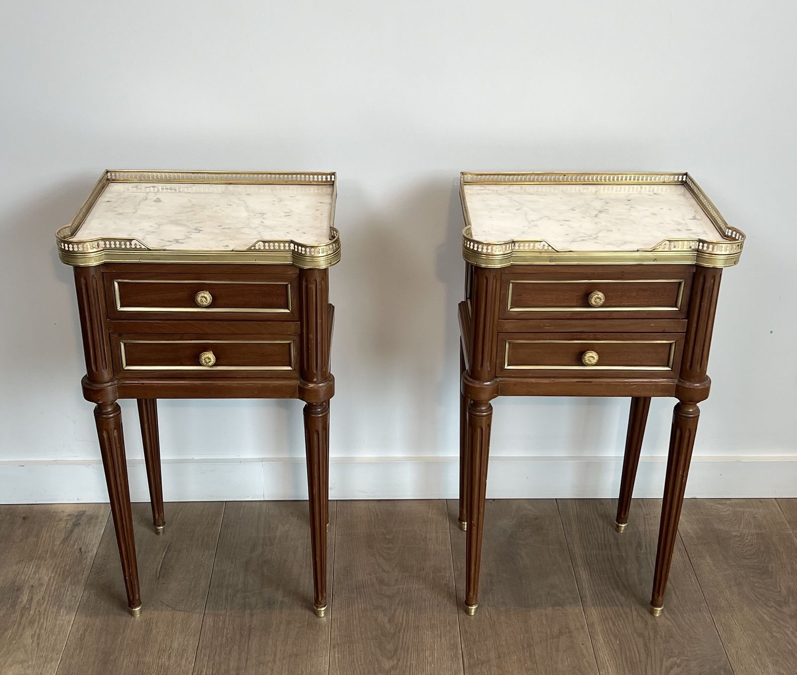 Pair Of Mahogany And Brass End Tables Or Bedside Tables With Carrara Marble Tops In The Style Of Maison Jansen. Circa 1940 photo for sale