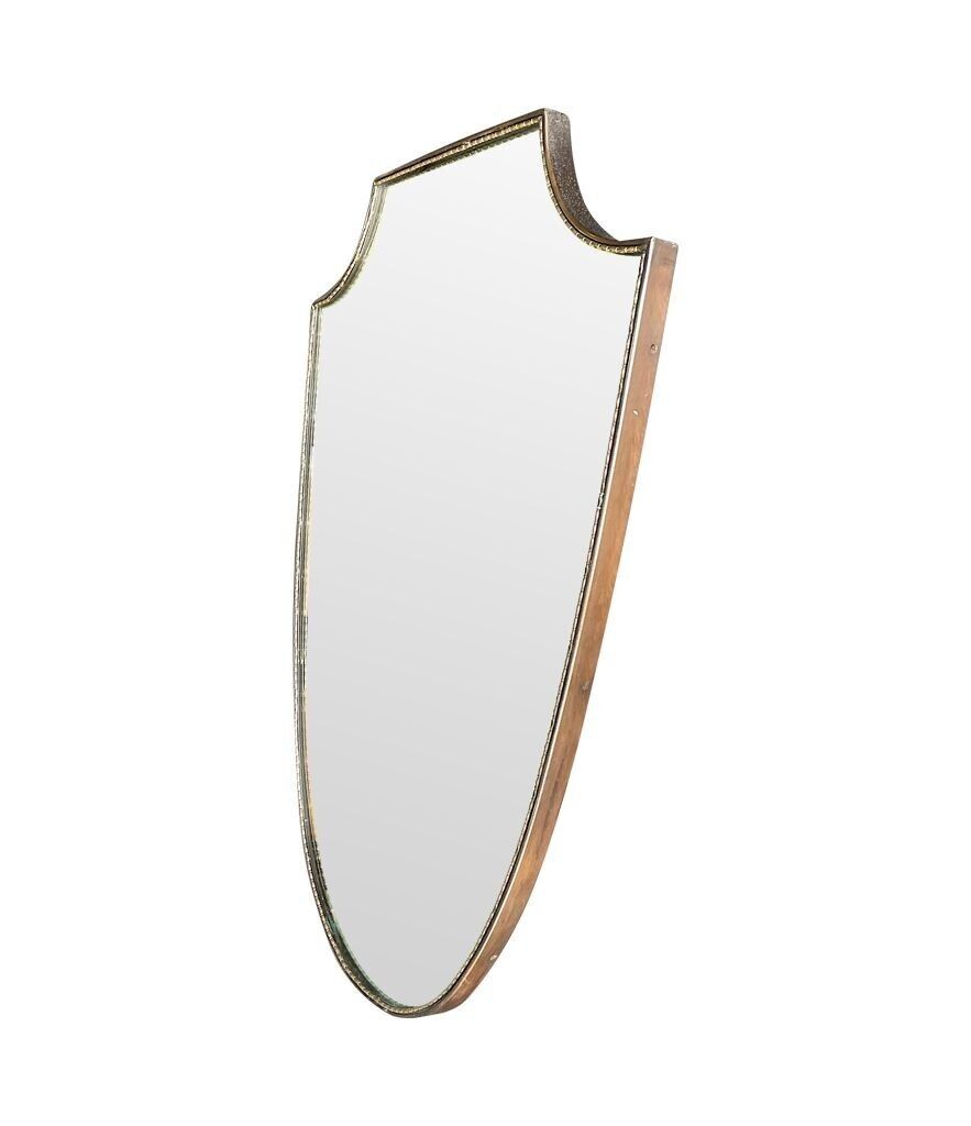 1575.0 An Orignal Italian 1960s Brass Shield Mirror With Beaded Inner Frame Detail photo