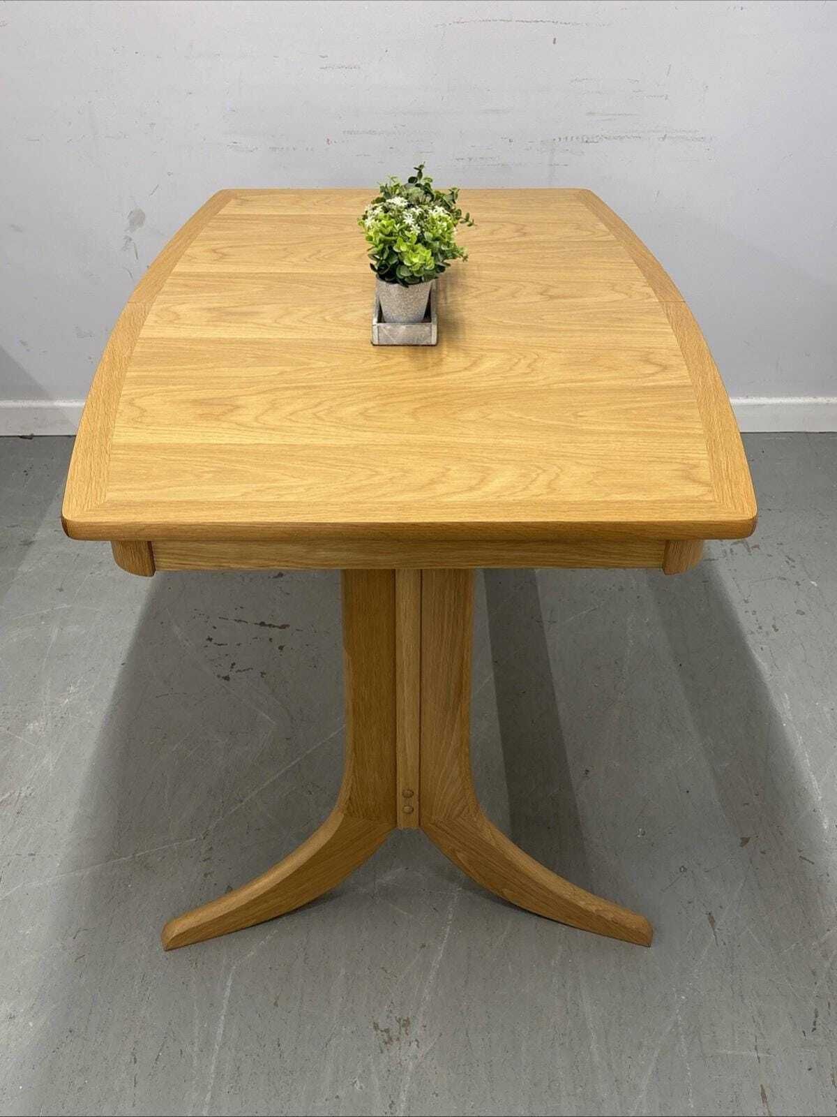 Nathan Shades Boat Shaped Extending Dining Table – Oak Finish photo furniture