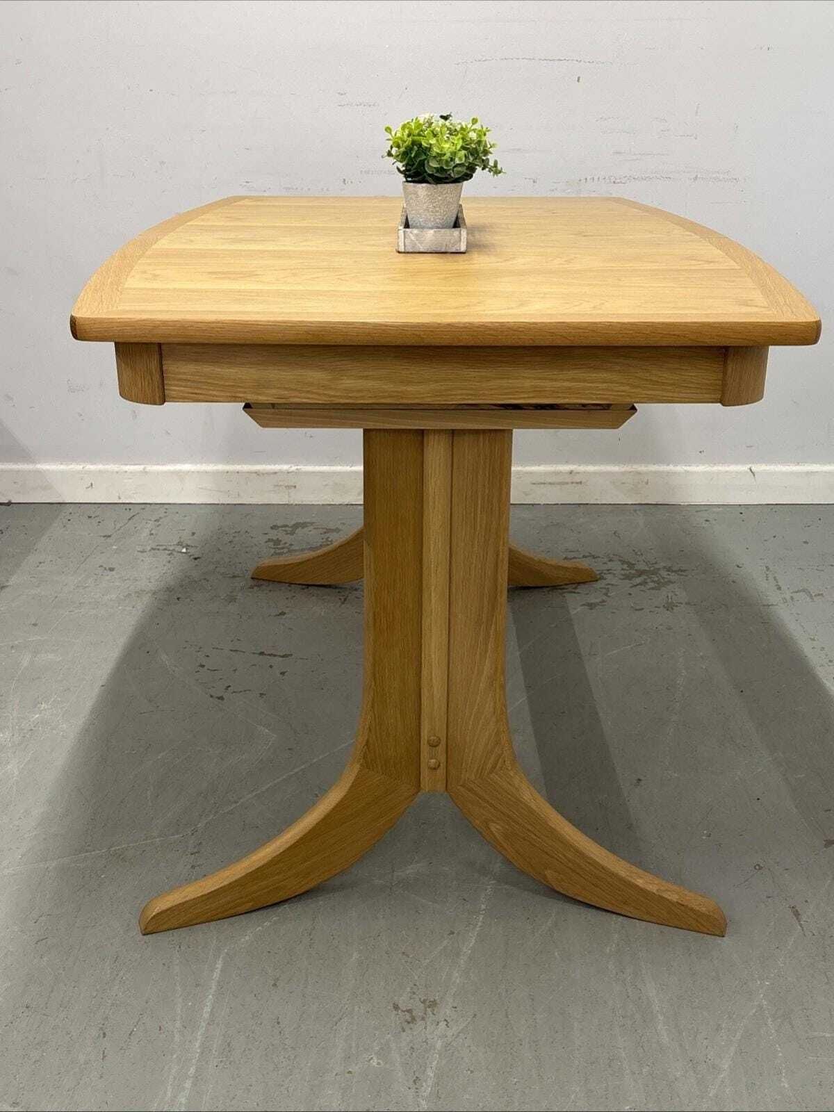 Nathan Shades Boat Shaped Extending Dining Table – Oak Finish photo Furniture