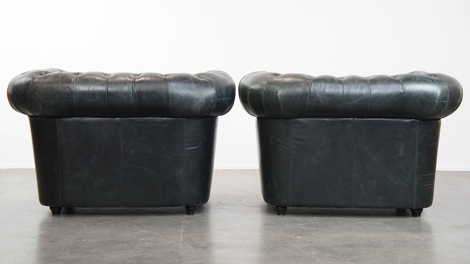 Timeless And Classic Set Of Spacious Black Chesterfield Armchairs Made Of Characterful Grained Cowhide photo for sale