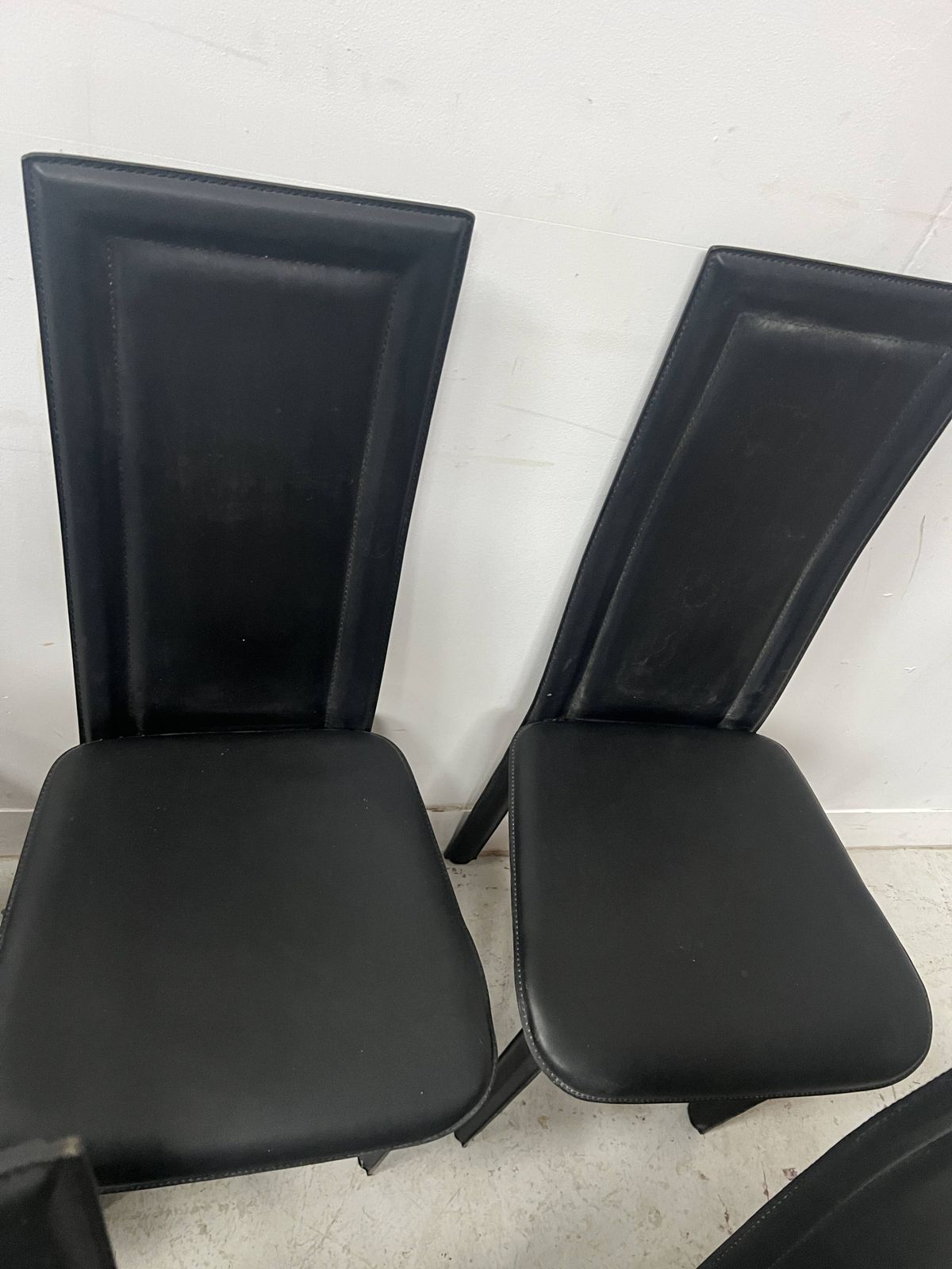 photo buy Set Of Eight Designer Chairs In Black Leather From The 20th Century