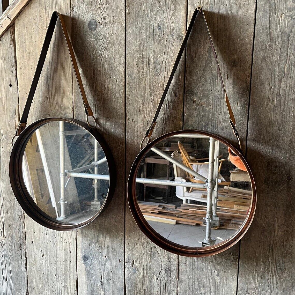 A Pair Of Wall Hanging Circular Metal Framed Mirror With Hanging Strap photo furniture