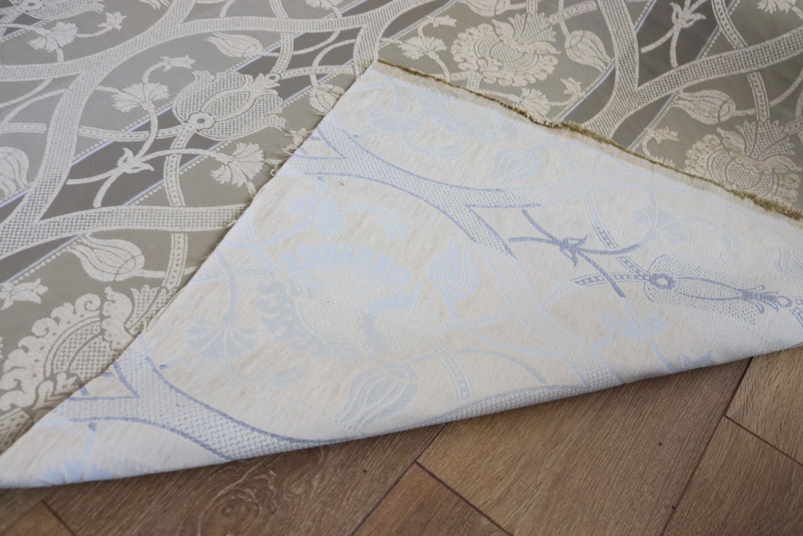 photo for sale Roll Of Gold Fabric With A Decorative Design
