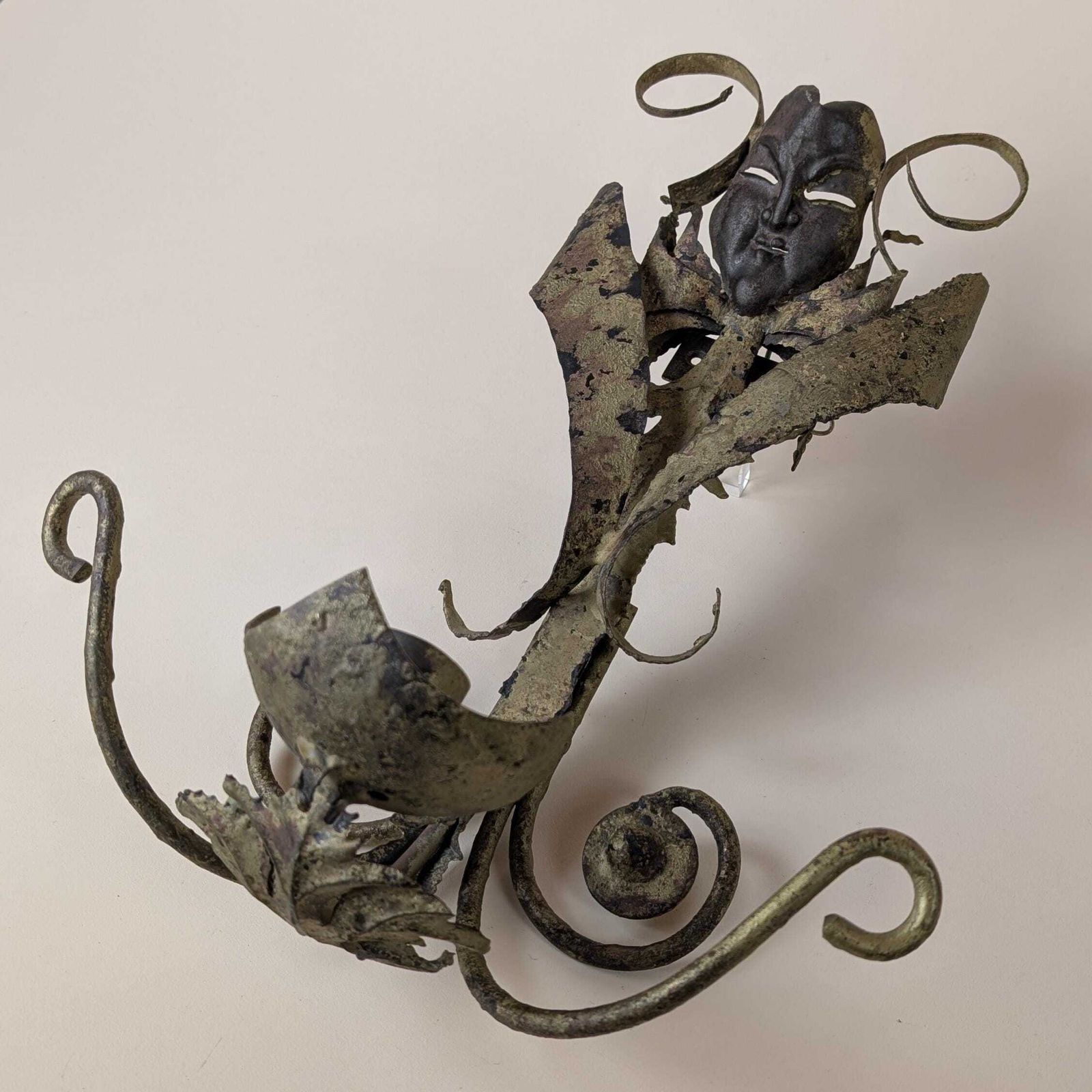 Vintage Spanish Brutalist Wrought Iron Mask Wall Sconce: Mid Century Decorative Gilt Metal Dramatic Patina Single Light Fixture From Spain photo for sale