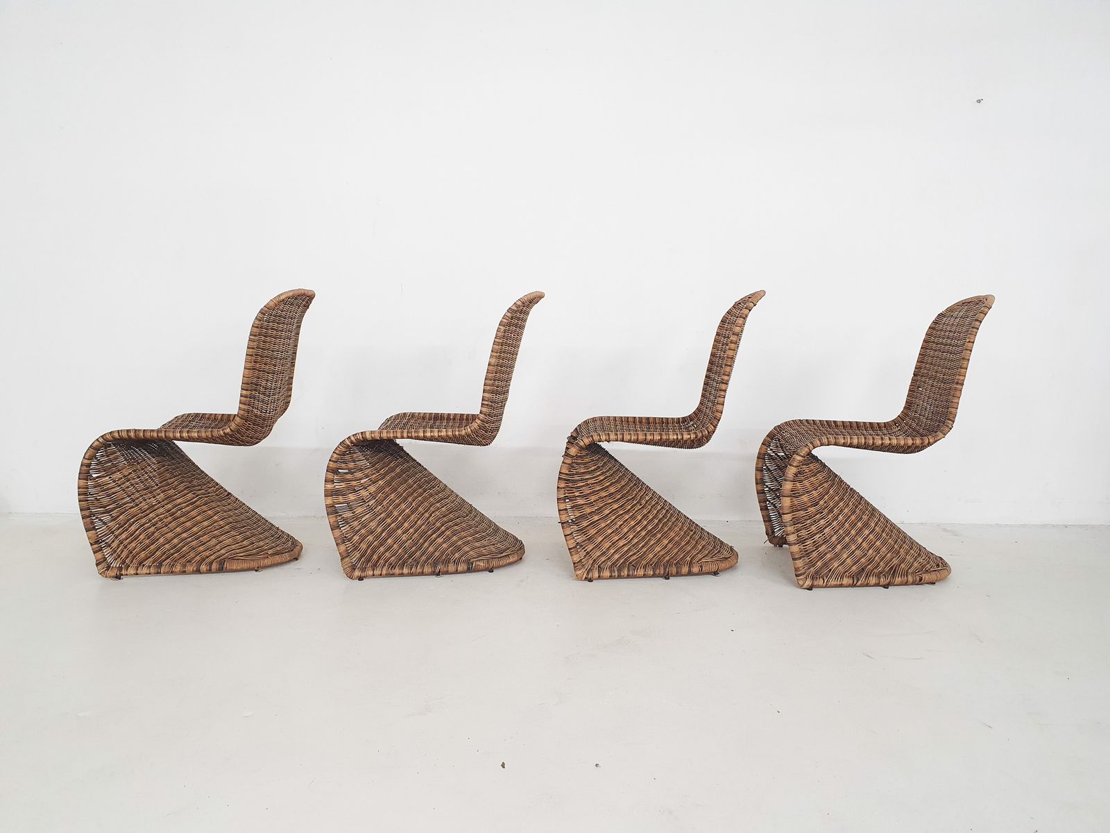 Set Of Four Rattan S Chairs In The Style Of Verner Panton photo furniture
