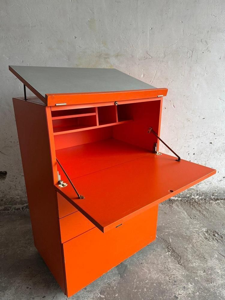Orange Chest Of Drawers With Fold Out Work Surface And Slanted Top photo 701.0