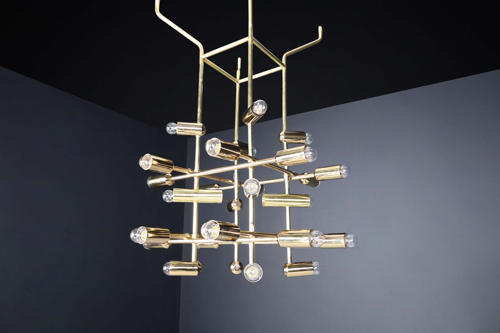 photo for sale Mid Century Brass Chandelier Wit 28 Lights, Switzerland 1960s.