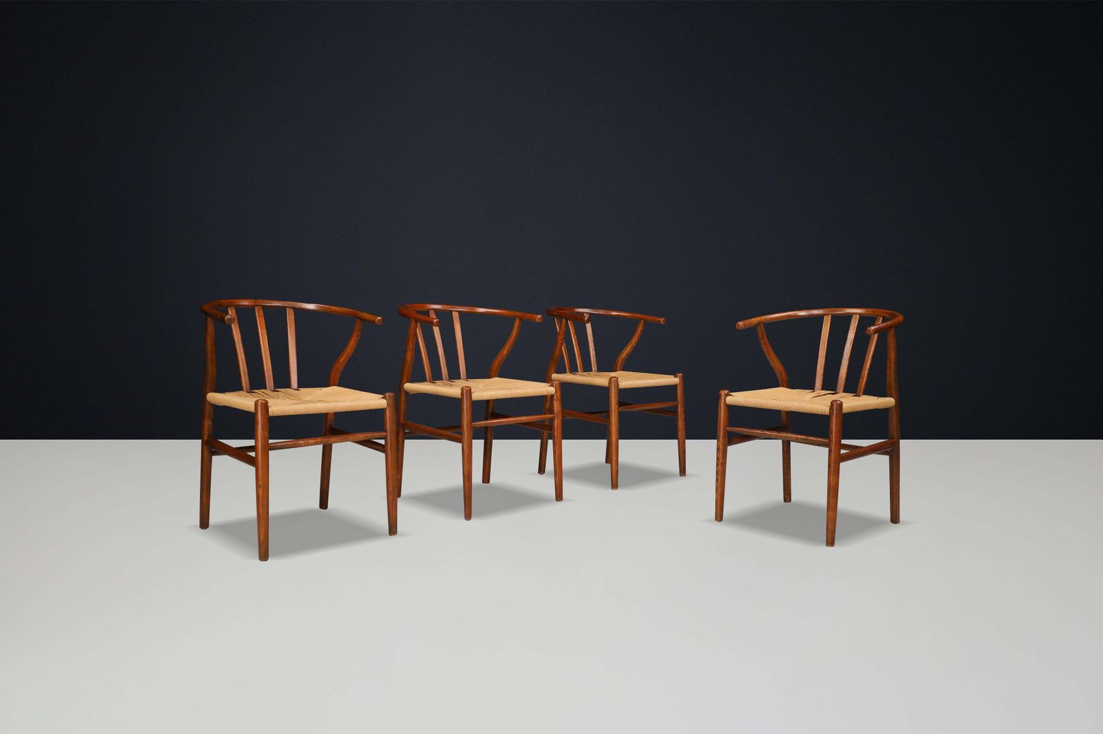 photo furniture Wicker And Oak Armchairs In The Style Of Hans J. Wegner Wishbone Chair Denmark
