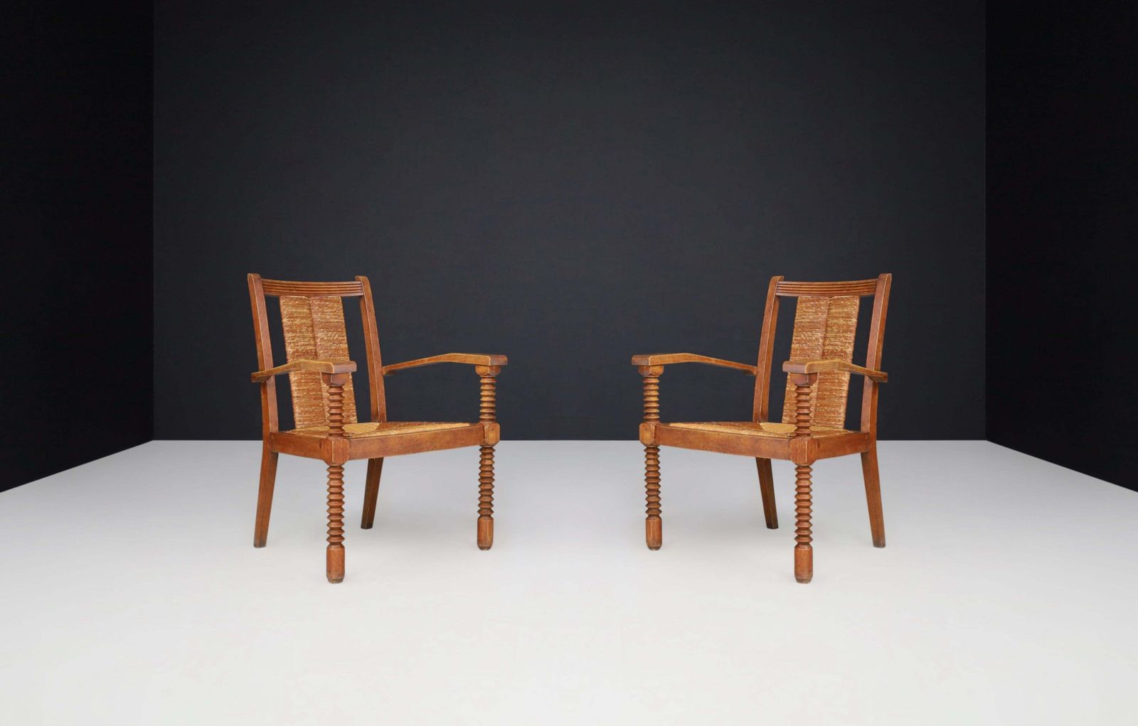 Charles Dudouyt Patinated Oak And Rush Armchairs, France 1940s photo for sale