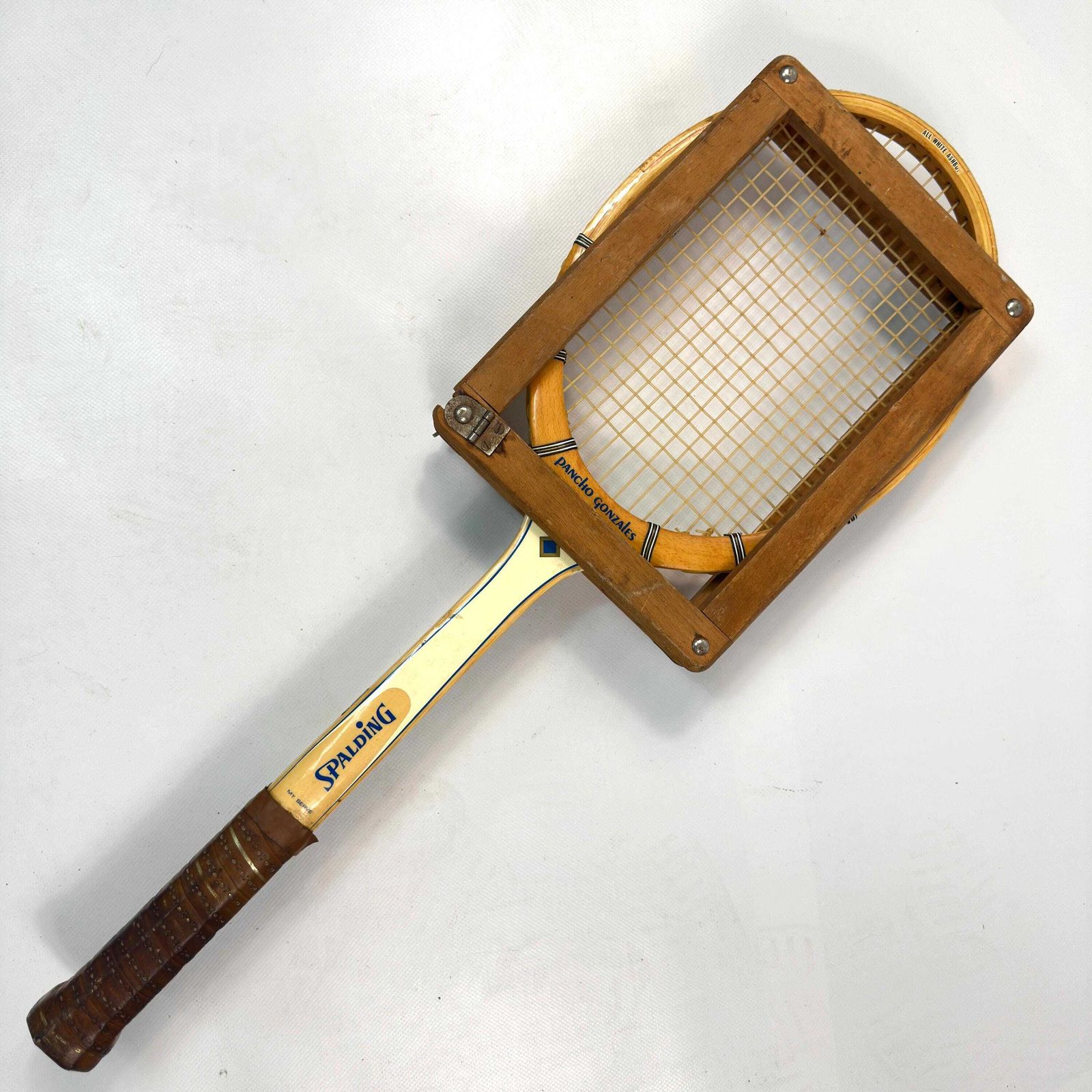 1960s Spalding Pancho Gonzales Tennis Racket With Press photo furniture