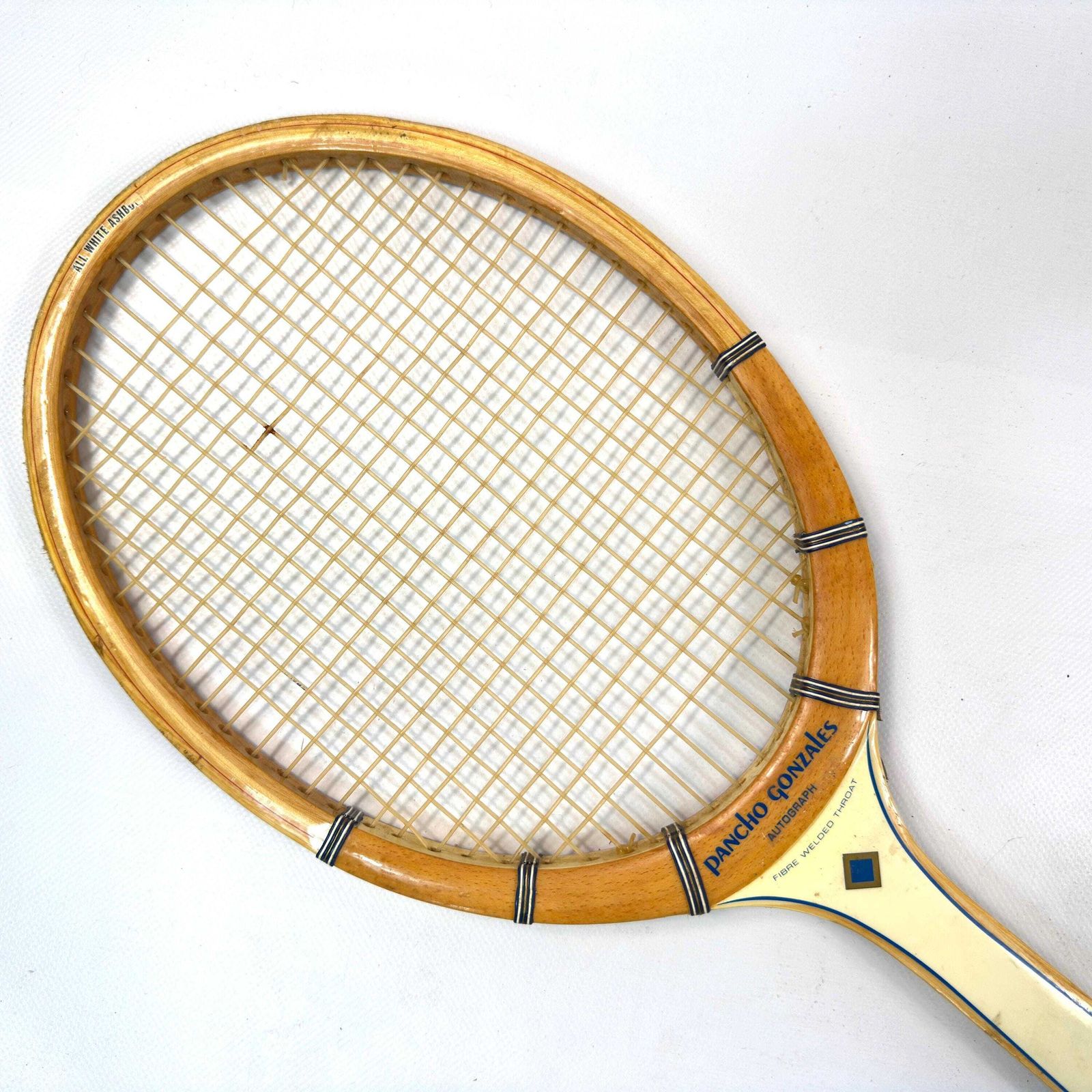 1960s Spalding Pancho Gonzales Tennis Racket With Press photo vinterior