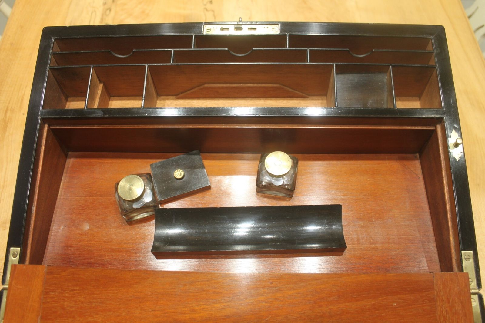 photo furniture A Large And Impressive Figured Walnut And Brass Bound Writing Slope With Secret Drawers