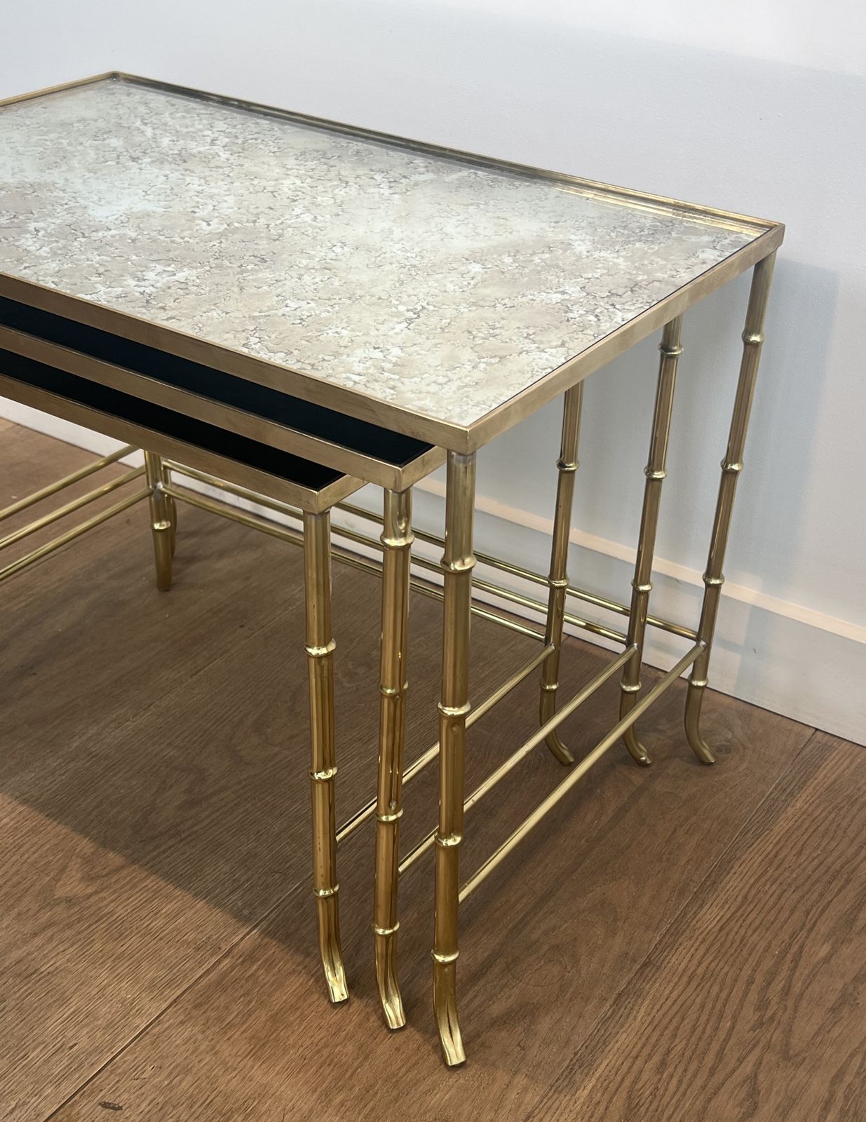 photo furniture Set Of Nesting Tables In Faux Bamboo Style, Brass With Eglomisé Glass Top By Maison Baguès