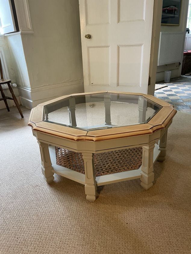 A Lovely Mahogany Octagonal Coffee Table On Pillar Legs And A Glass Top.