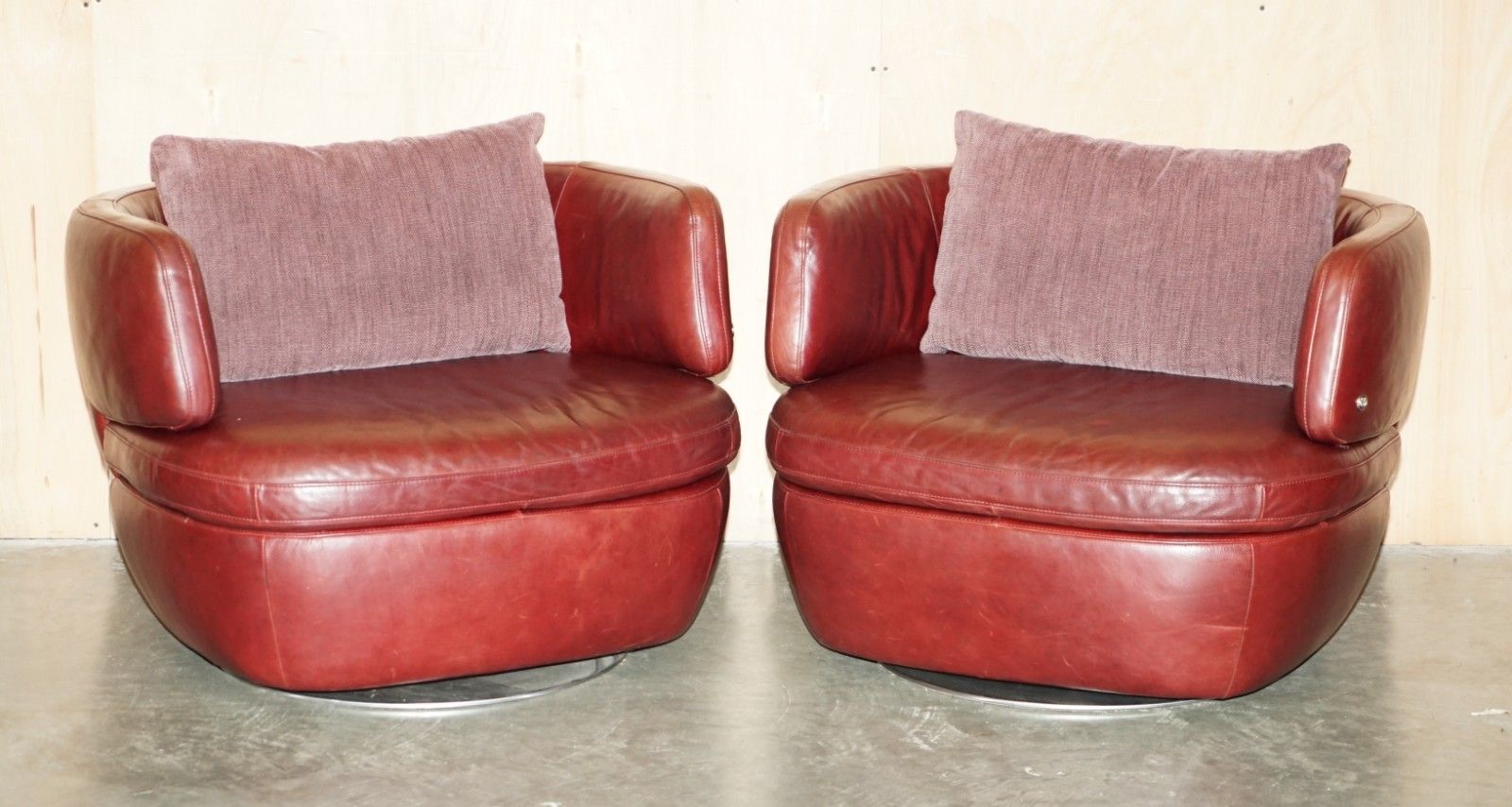 Pair Of Exquisite Bordeaux Leather Natuzzi Swivel Armchairs With Lumbar Cushions photo furniture