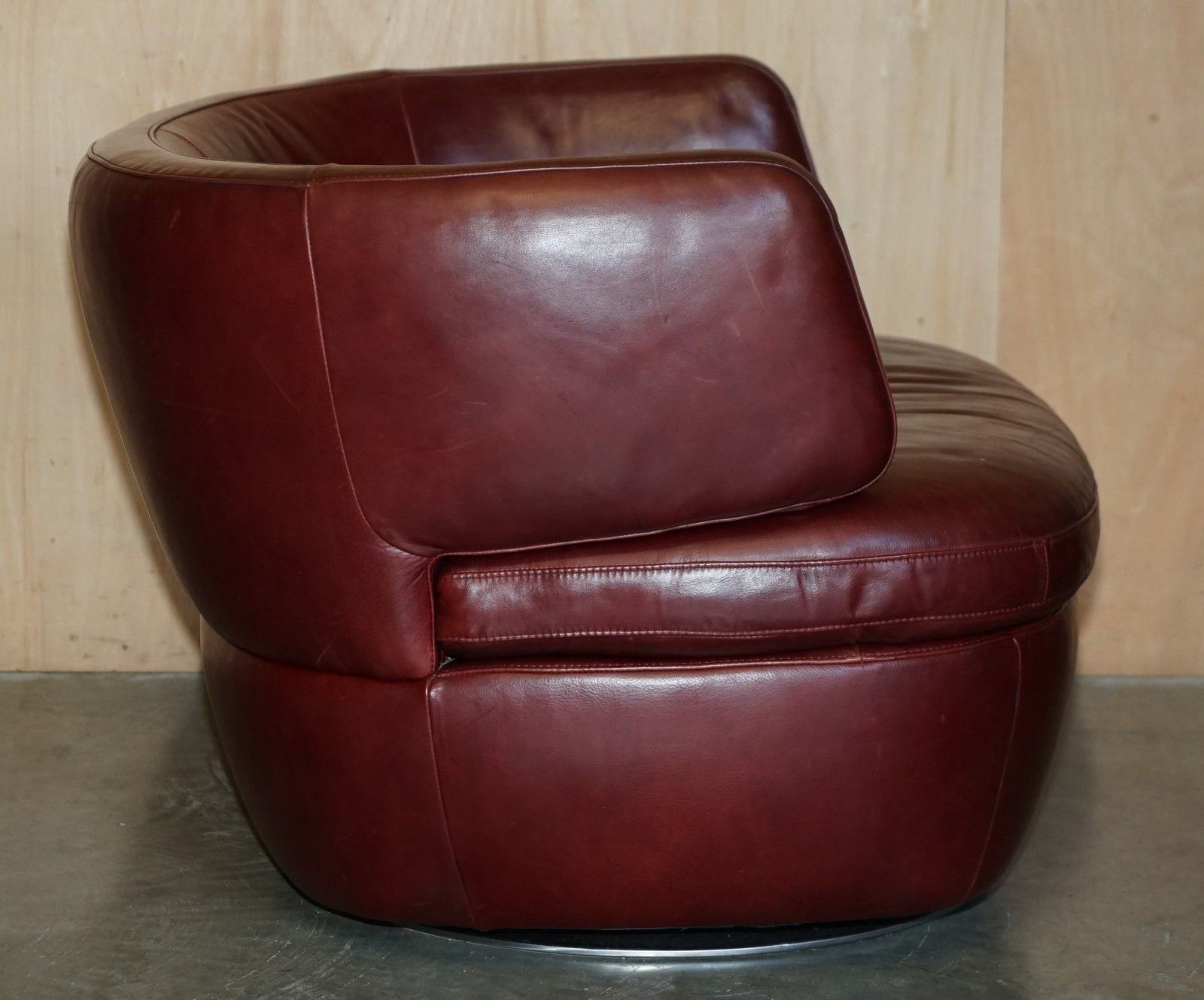 3500.0 Pair Of Exquisite Bordeaux Leather Natuzzi Swivel Armchairs With Lumbar Cushions photo