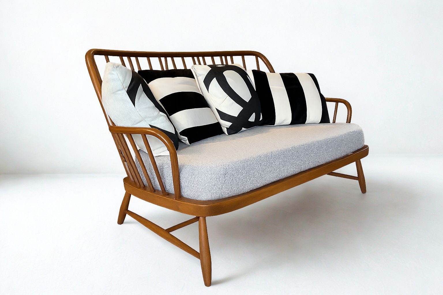 Ercol Jubilee 766/2 Two Seater Sofa With Grey Boucle Fabric And Monochrome Scatter Cushions photo furniture