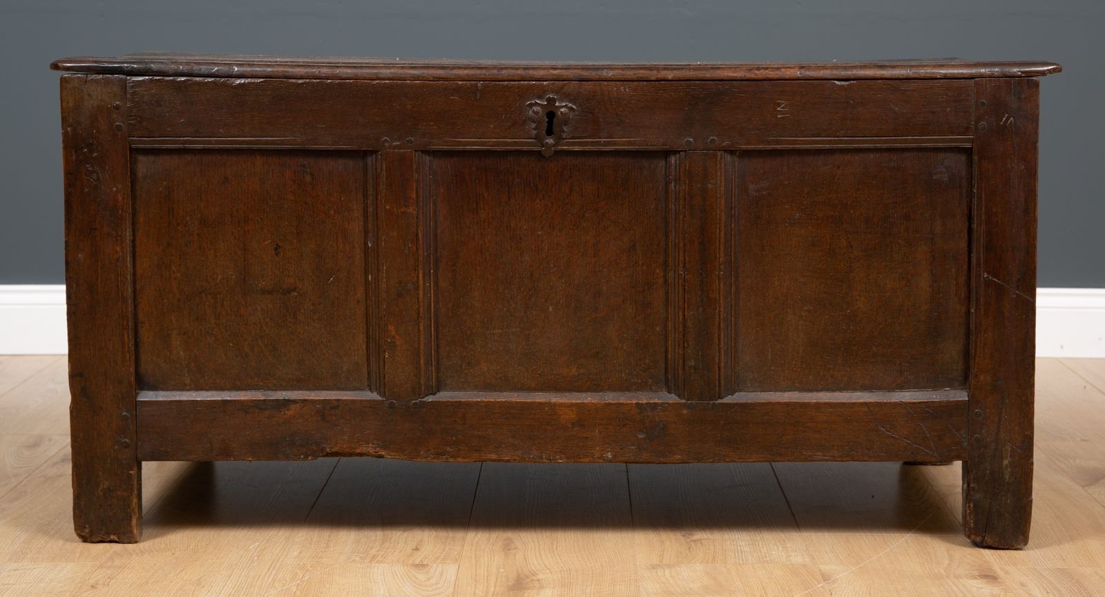 An 18th Century Oak Chest With Two Panelled Front And Fitted With A Candle Box Within