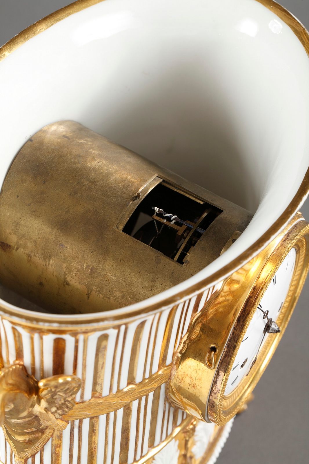 4966.0 Gilt Porcelain Clock In The Shape Of A Vase, Early 19th Century photo