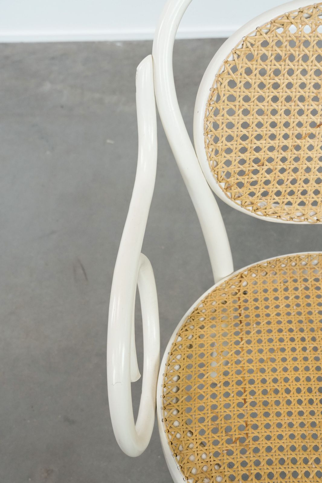 Vintage White Bistro Chair With Armrests In Thonet Style With A Graceful Curved Wooden Frame, Webbing Seat And Backrest photo buy