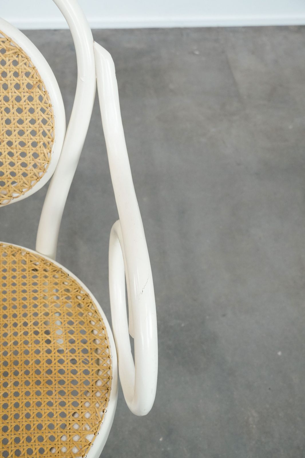 Vintage White Bistro Chair With Armrests In Thonet Style With A Graceful Curved Wooden Frame, Webbing Seat And Backrest photo vintage