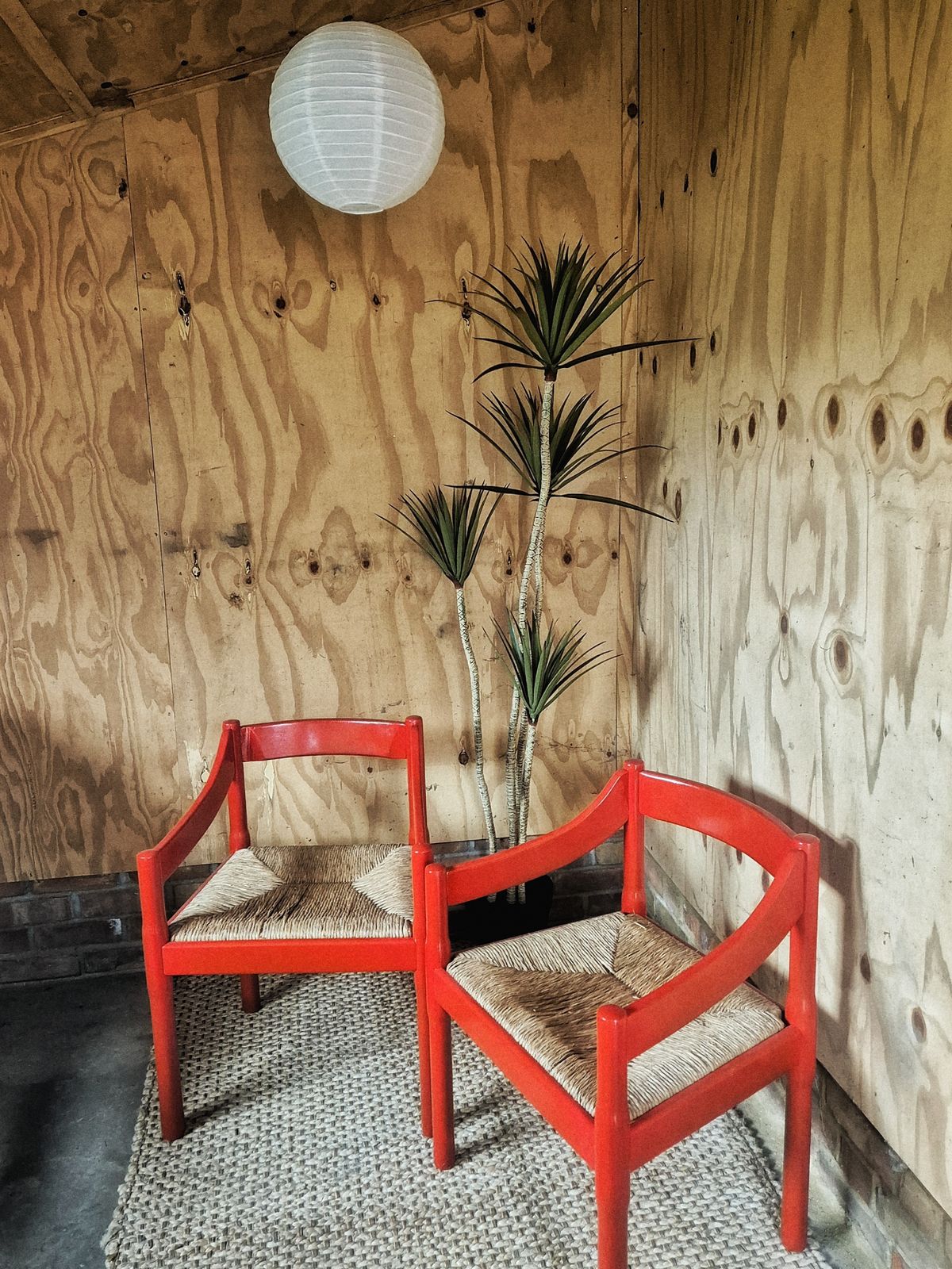 A Pair Of Red Vico Magistretti Carimate Carver Chairs