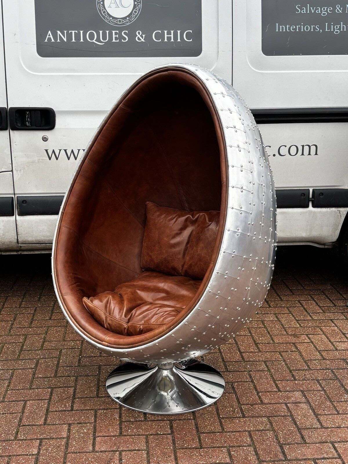 Aviation Swivel Egg Chair With Tan Leather. photo furniture