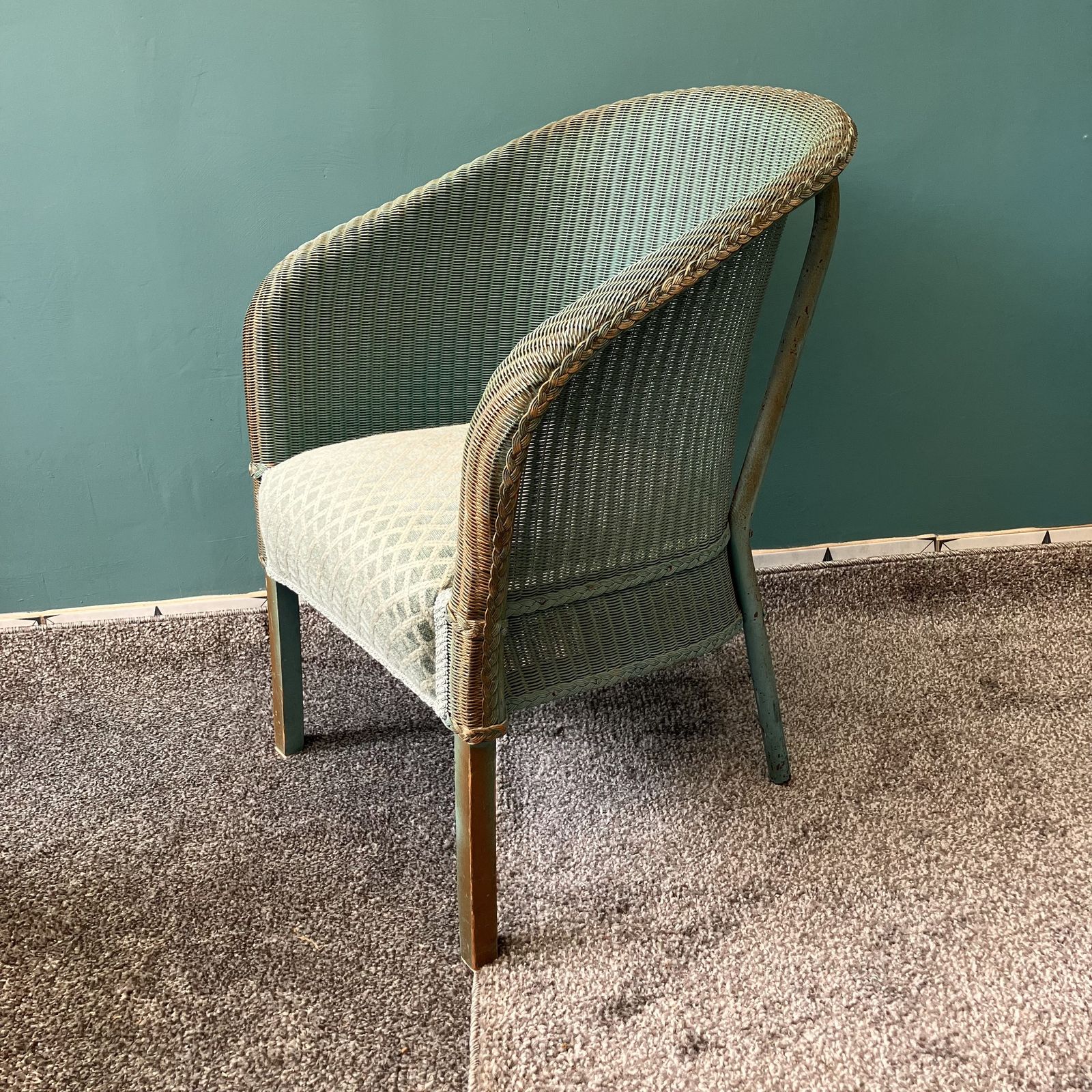 A Lloyd Loom Chair In Teal With Sprung Upholstered Seat photo furniture
