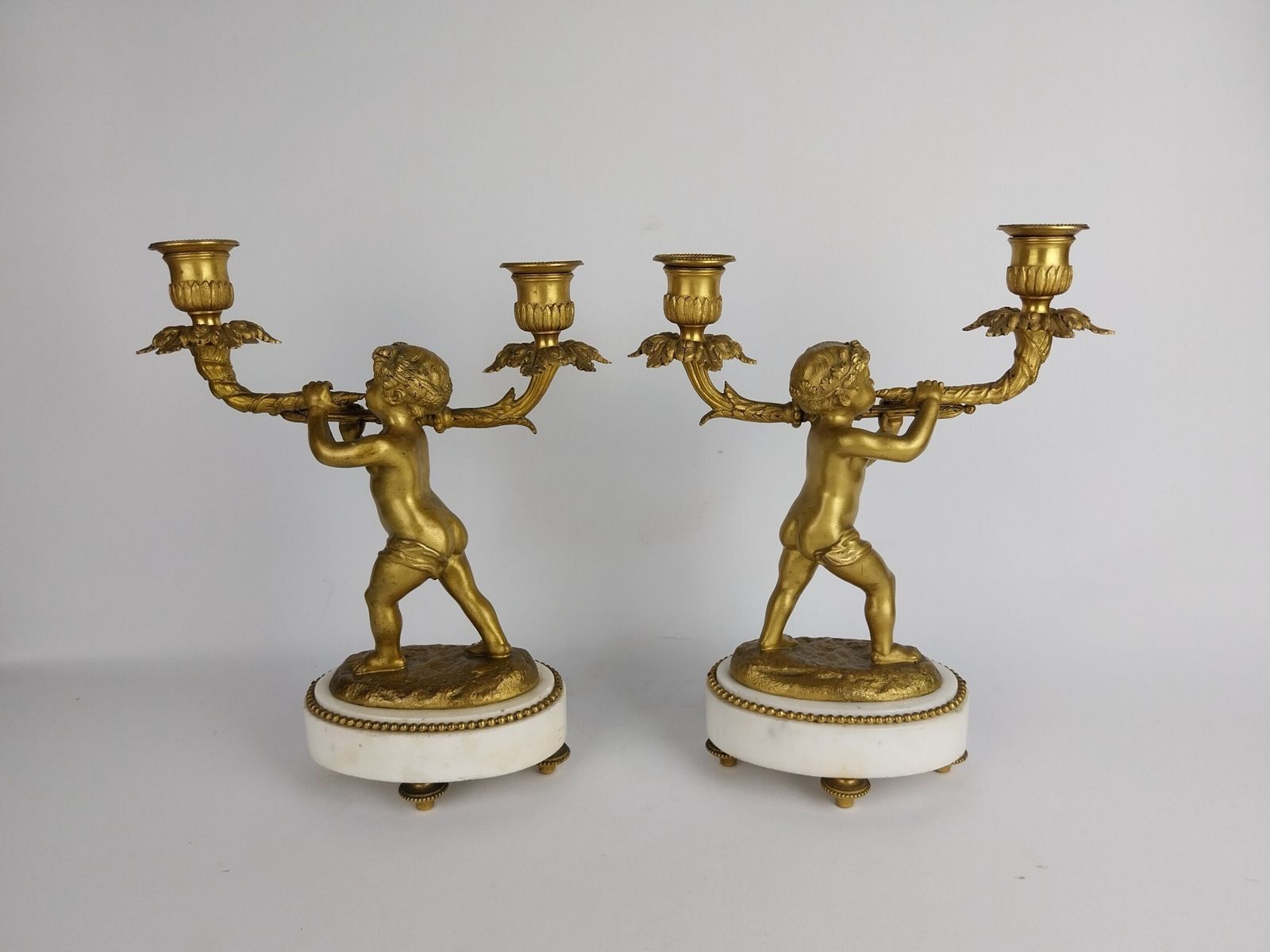 photo furniture Pair Of Gilt Bronze Cherub Candlesticks