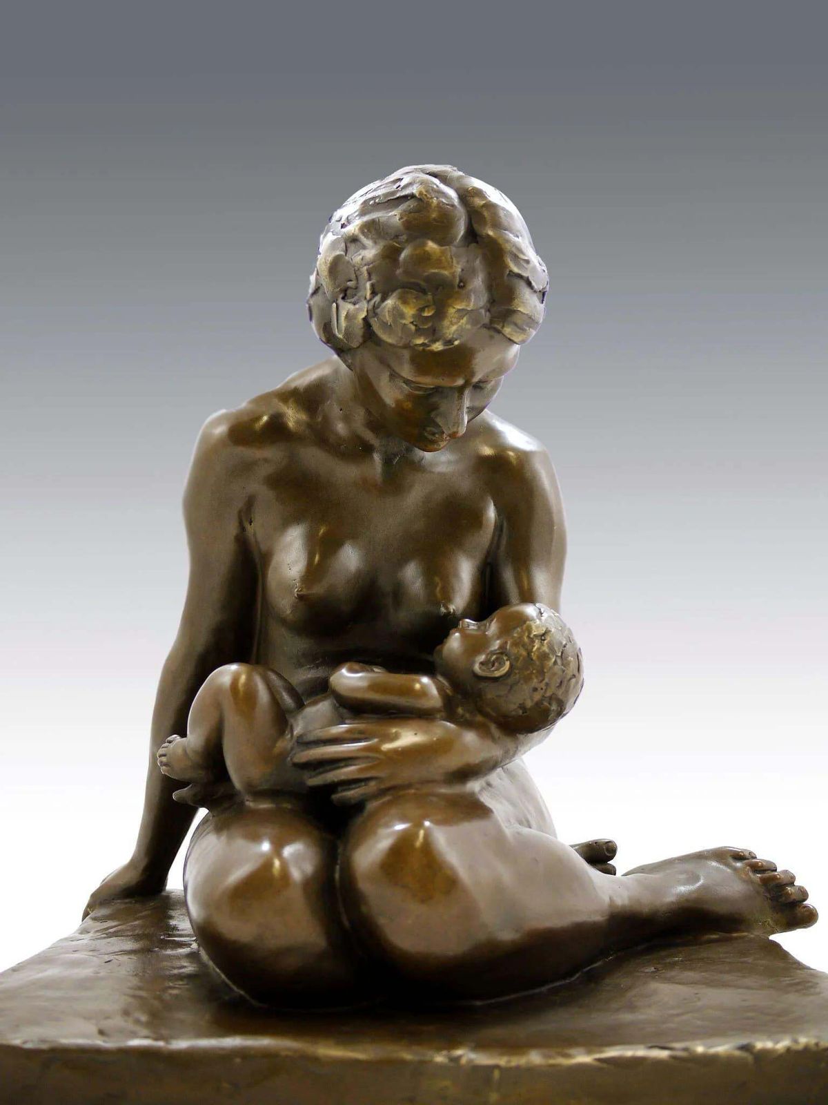 photo furniture Bronze Sculpture Depicting A Mother And Her Child