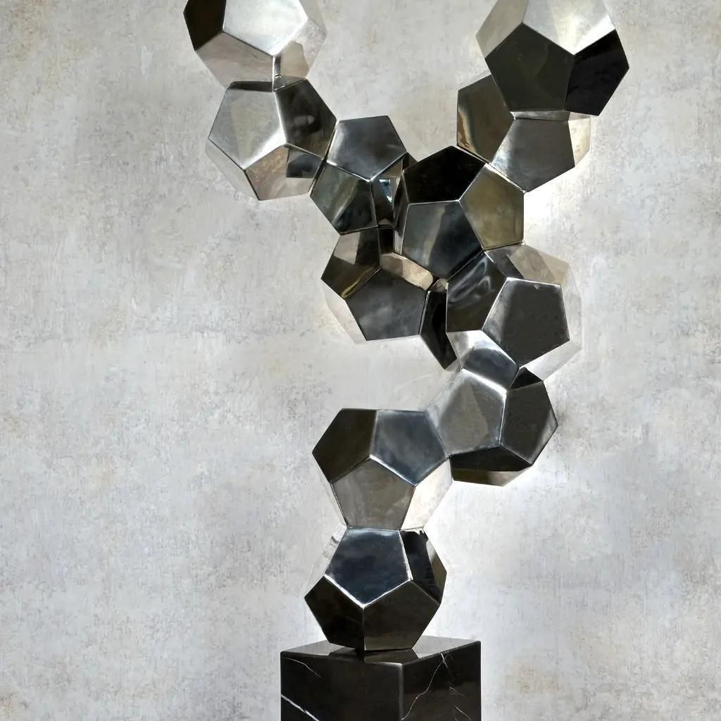 Contemporary Sculpture In Chromed Metal On A Black Marble Base photo for sale
