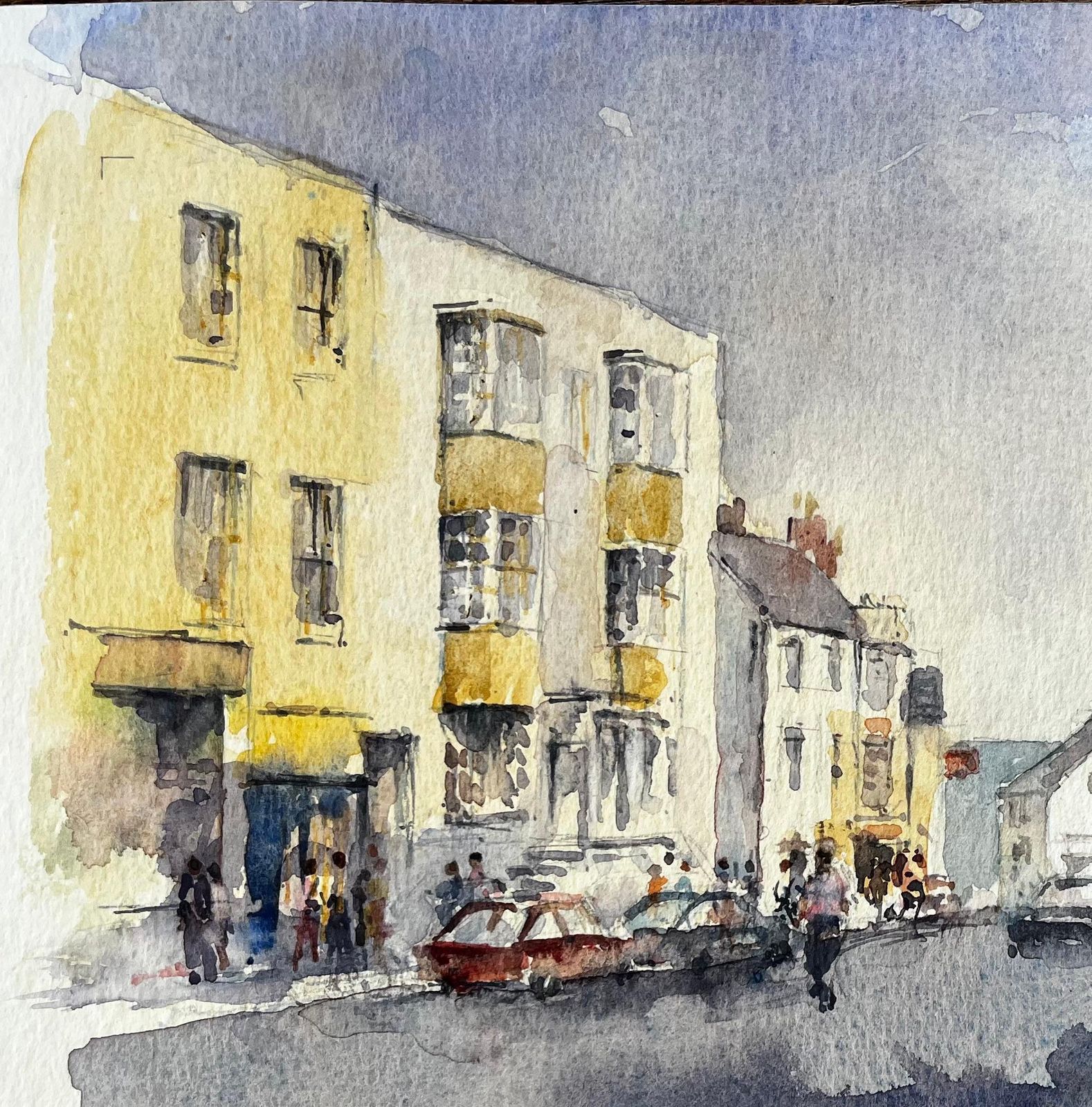 Anthony Herbertbusy High Street Scene With Figures Cars And Yellow Townhouses Watercolour photo 530.0