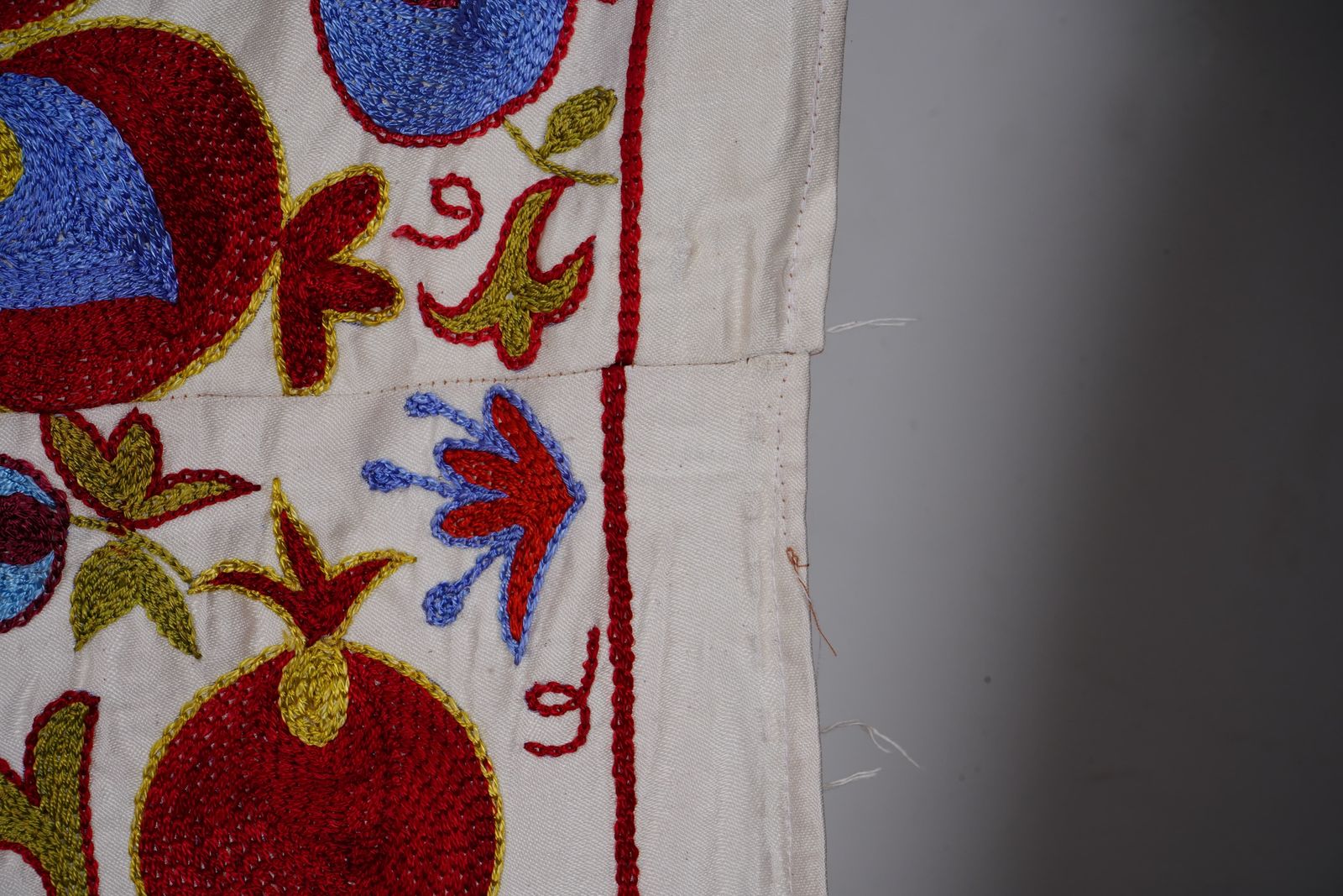 photo for sale Suzani Tapestry – White Base With Horse And Pomegranate Motifs 3'2'' X 6'