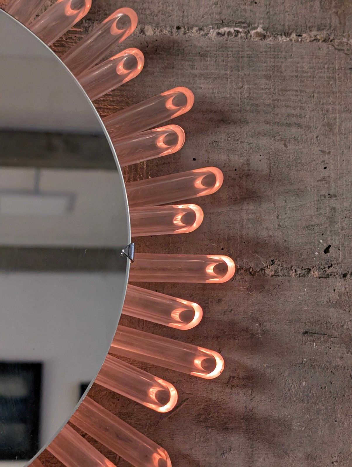 Mid Century Modern Sun Mirror Wall Mirror In Lucite With Pink Light, 1970s photo for sale