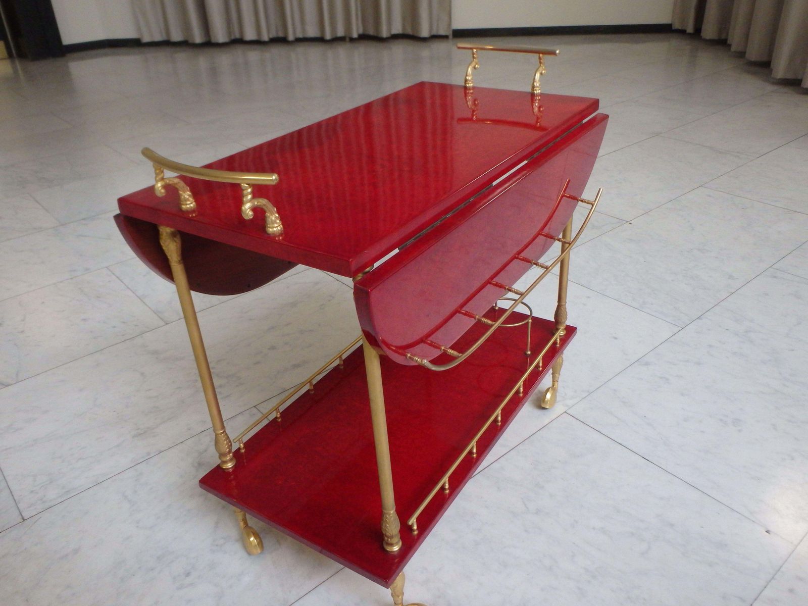 Vibrant Red Coat Skin Bar Cart By Aldo Tura With Wings To Be Opend photo vintage
