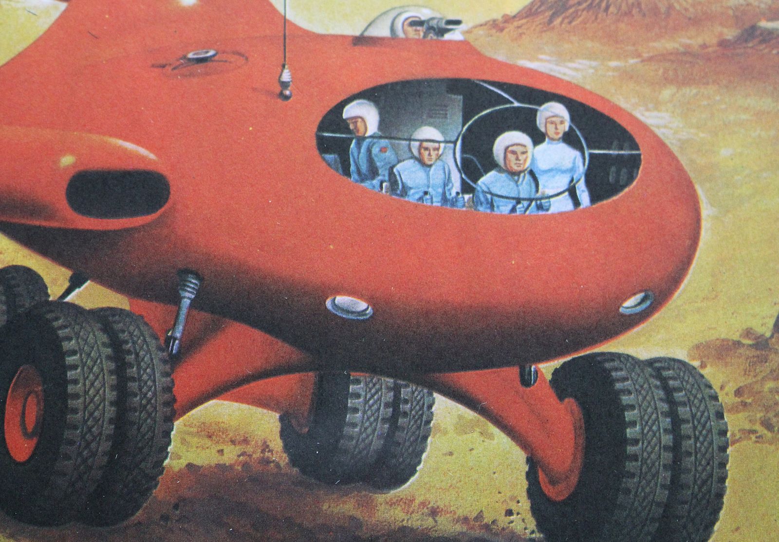 A Framed Mid Century Print 'Experimental Rocket Car Designed For Future Moon Exploration' photo furniture