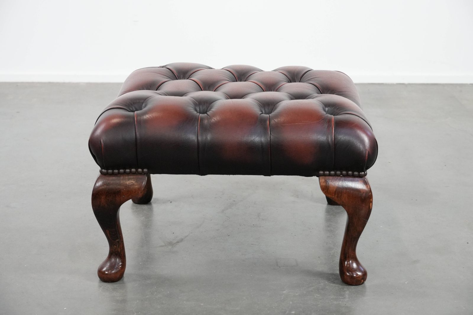 Elegant And Graceful Dark Brown Chesterfield Footstool Made Of Cowhide photo furniture