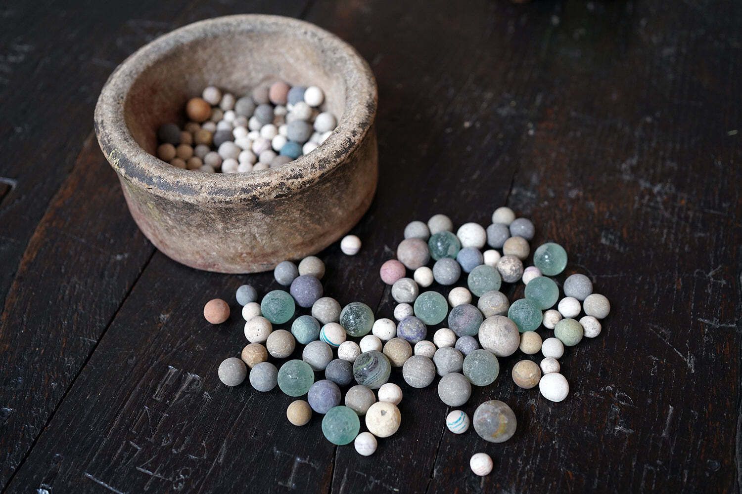 photo for sale A Late 19thc Indian Marble Bowl Containing A Collection Of Clay & Glass Marbles