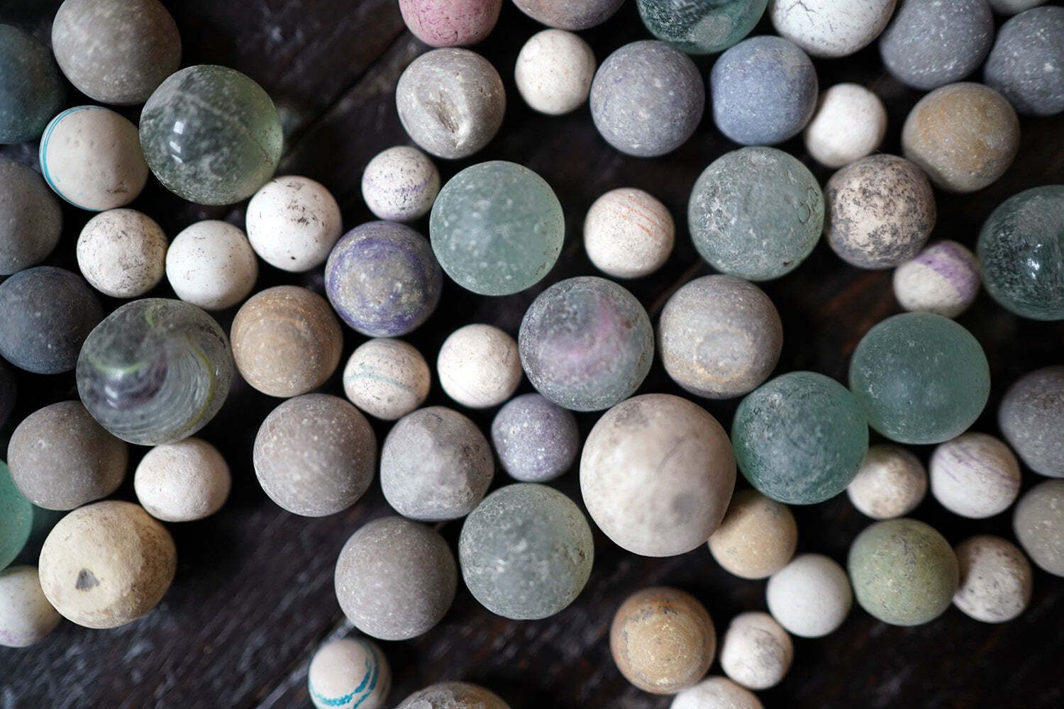 photo buy A Late 19thc Indian Marble Bowl Containing A Collection Of Clay & Glass Marbles
