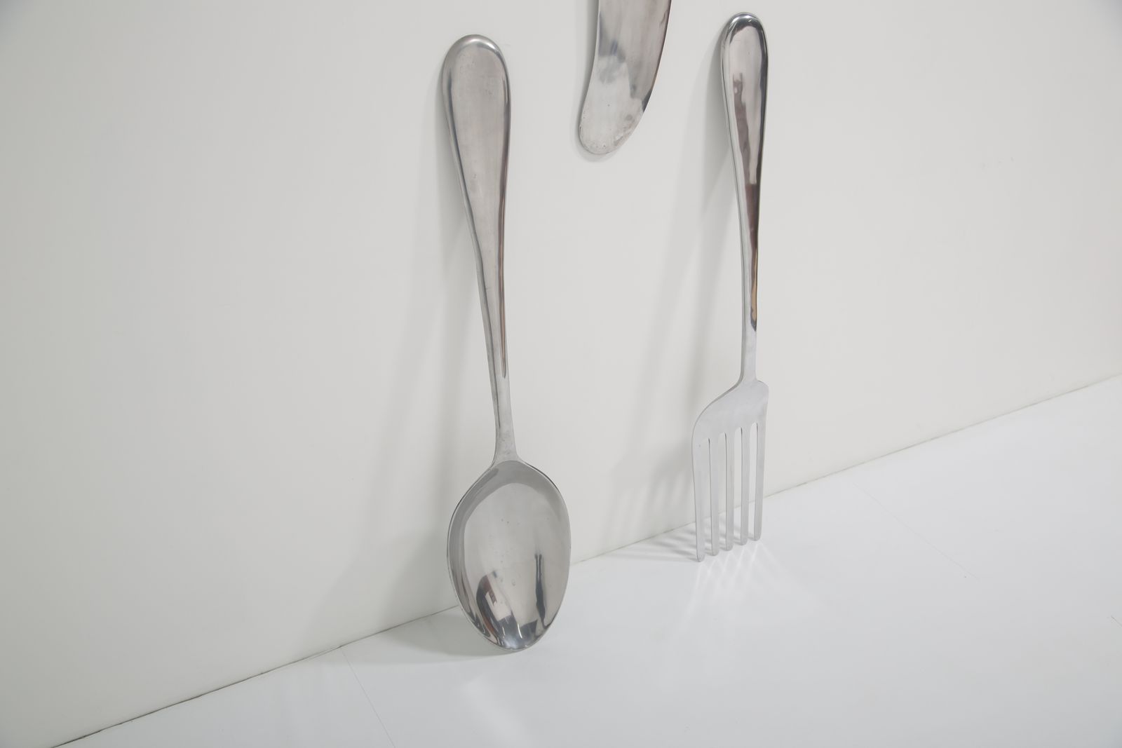 photo for sale Monumental Aluminum Novelty Cutlery Wall Sculptures By Curtis Jere, 1960/70s.