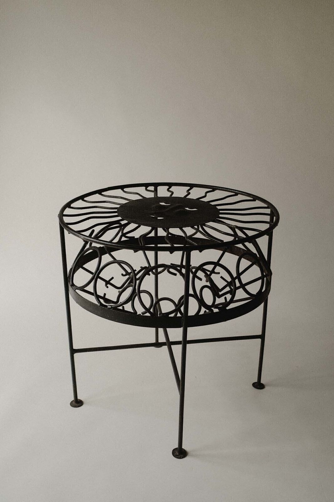 Sculptural Iron Table With Sunburst Face photo buy