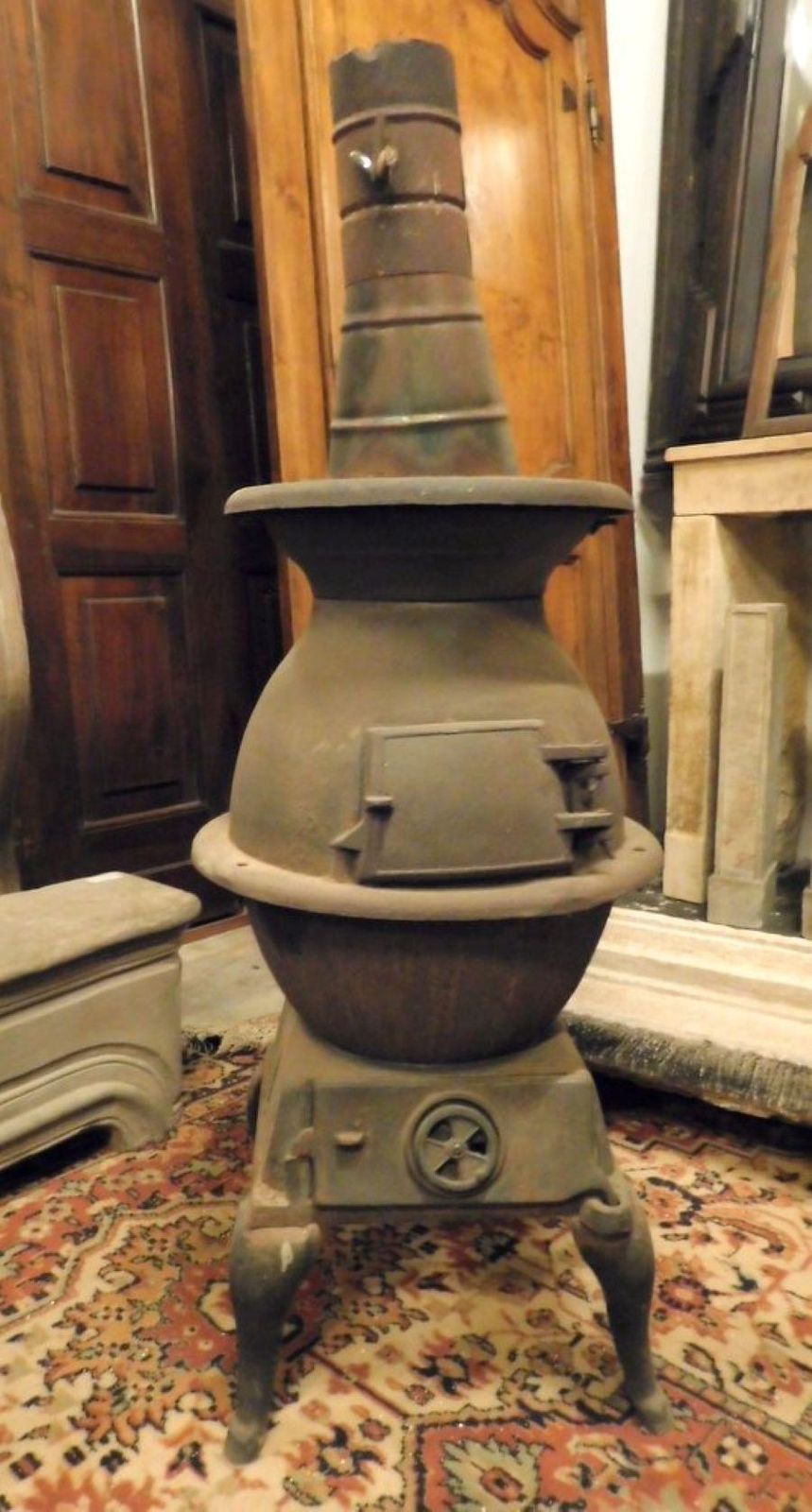 Dark Wrought Iron Stove, Typically From The Italian Valleys photo Home Fixtures