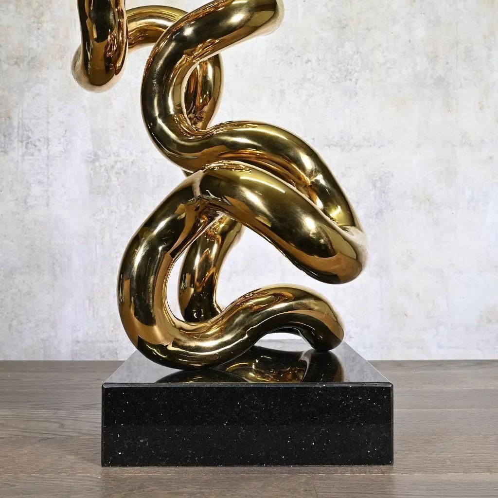 Gold Tubular Metal Sculpture On Black Base, Contemporary Style photo Art