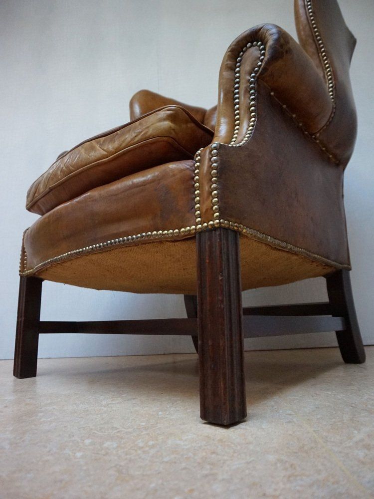 Furniture Mid Century Cognac Leather Chesterfield Wingback Armchair, 1960s photo