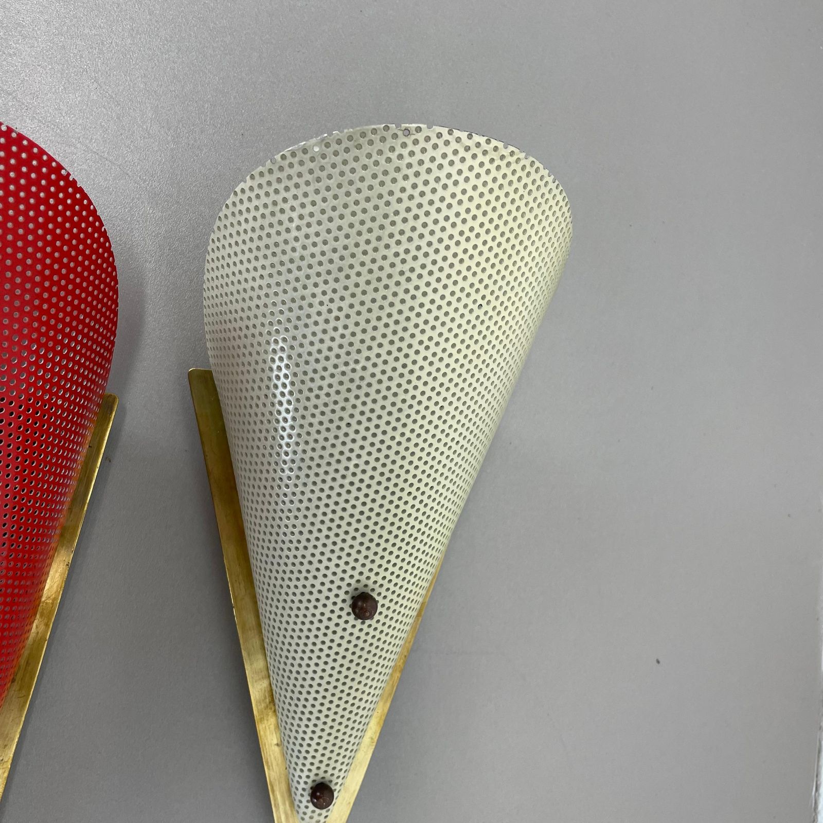 photo furniture Set Of Two Hole Pattern Theatre Wall Light Sconces Mategot Style, France, 1950